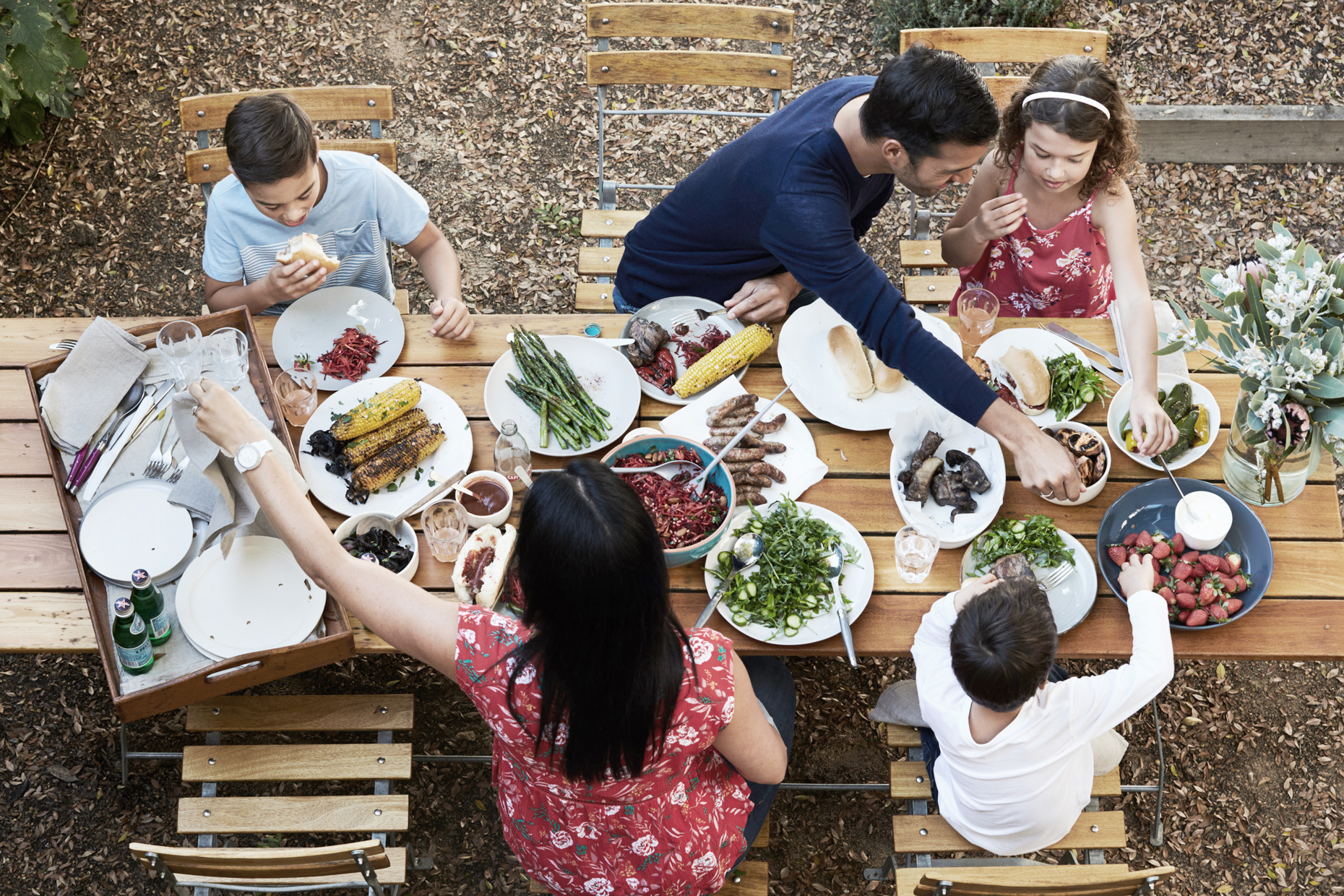 family enjoying outdoor dining captured by lifestyle food photographer james braund of melbourne